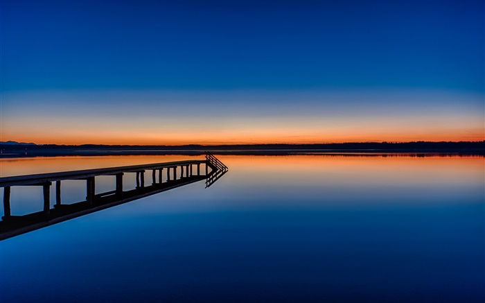 Calm lake, bridge, dusk, reflection in the water Wallpapers Pictures Photos Images
