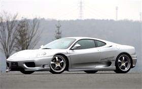Ferrari silvery supercar side view