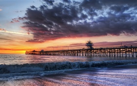 Coast, pier, sunset, sea, waves, clouds HD wallpaper