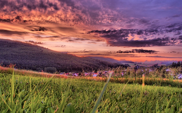 Grass, mountains, village, red sky, dusk, clouds Wallpapers Pictures Photos Images