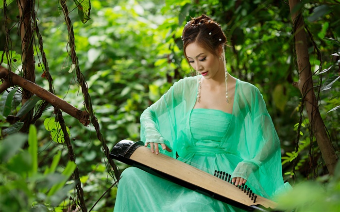Green dress Asian girl playing the zither Wallpapers Pictures Photos Images