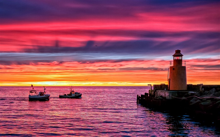 Lighthouse, beach, sea, boats, sunset, red sky Wallpapers Pictures Photos Images