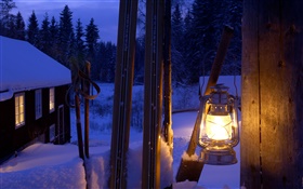Lit lantern, gatepost, Sweden, night