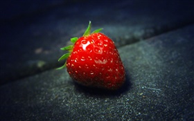 One fresh red strawberry macro