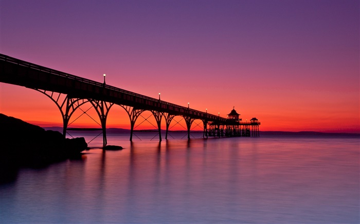 Red sky, pier, sea, sunset, lights Wallpapers Pictures Photos Images