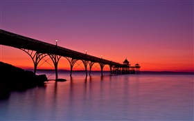 Red sky, pier, sea, sunset, lights HD wallpaper