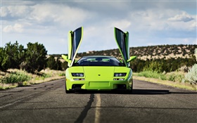 Green Lamborghini supercar front view, wings