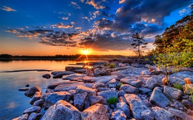 Sunset, lake, trees, stones, clouds HD wallpaper