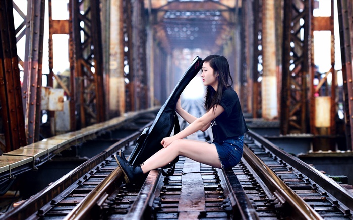 Girl sit at railroad play guitar, bridge Wallpapers Pictures Photos Images