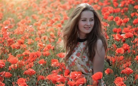 Girl in the flowers field, red poppies, summer