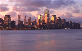 New York, USA, buildings, skyscrapers, lights, sea, evening, sunset, clouds HD wallpaper