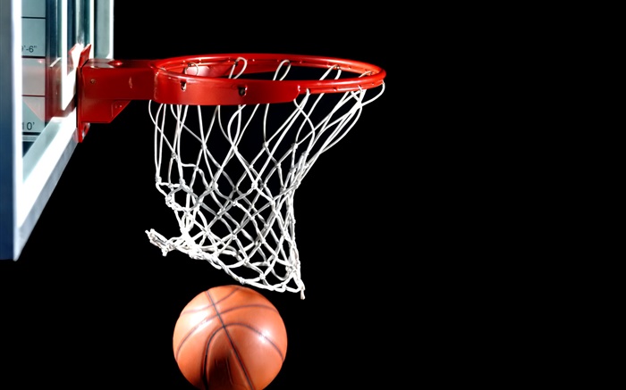 Basketball into the basket, black background Wallpapers Pictures Photos Images