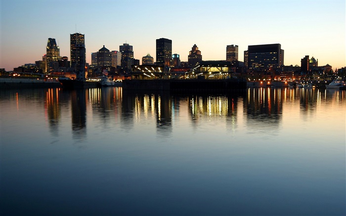 Evening, dusk, city, buildings, river, water reflection Wallpapers Pictures Photos Images