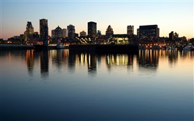 Evening, dusk, city, buildings, river, water reflection