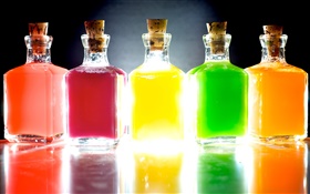 Colorful bottles, five different colors, light