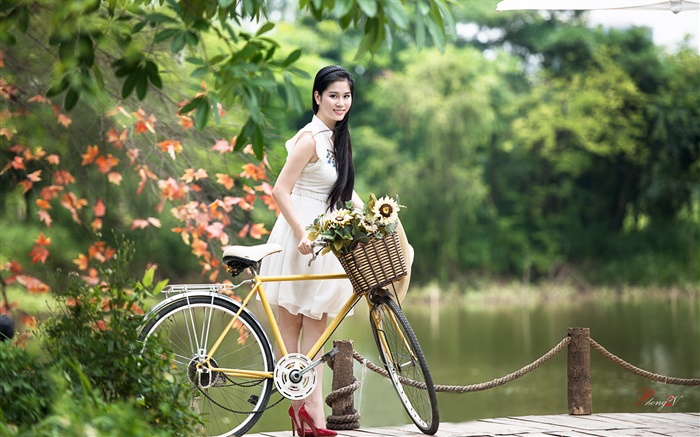 Smile Asian girl, white dress, bike, park Wallpapers Pictures Photos Images