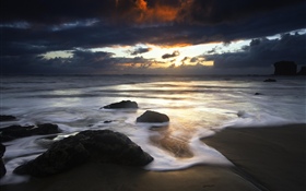 Beach, stones, sea, clouds, sunset HD wallpaper