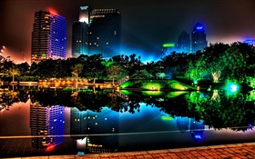 Beautiful night city, buildings, pond, lights, trees, park