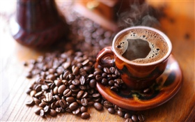 Coffee beans, cup, foam, steam