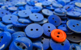 Many blue buttons, one red